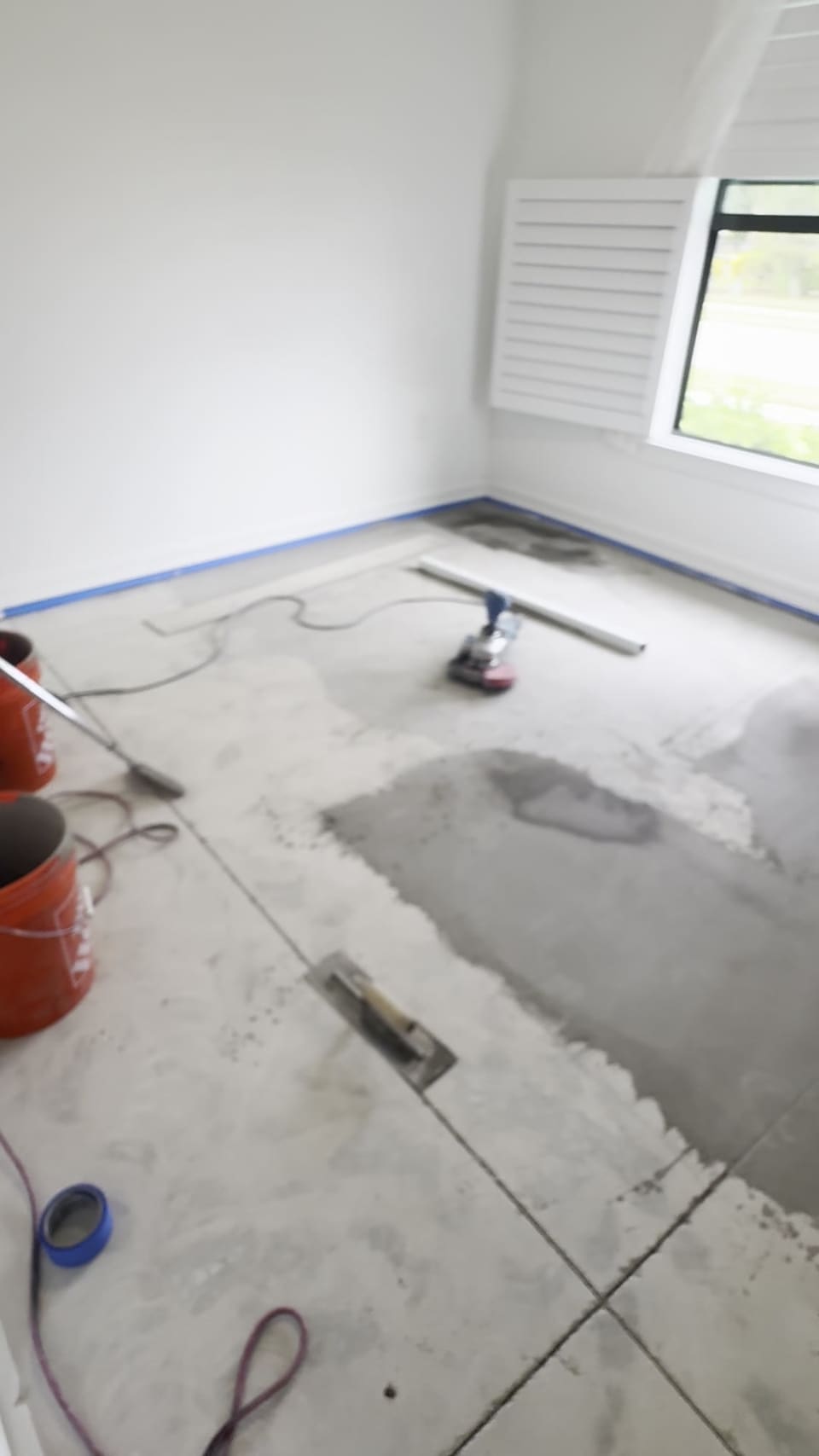 Old tile removed and the slab prepped before new flooring