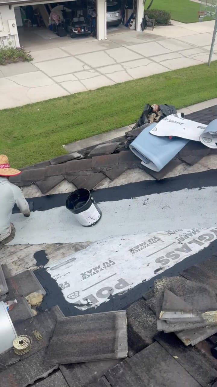 Tile roof repair with new underlayment going down