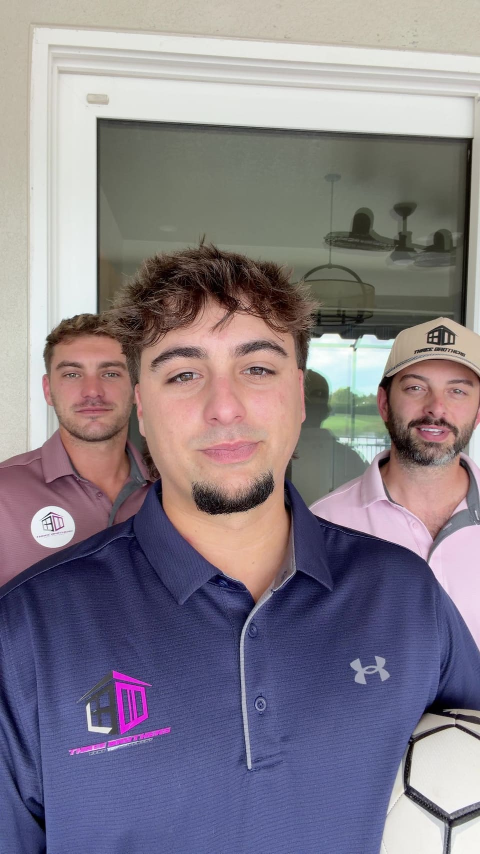 The Three Brothers team in their branded shirts